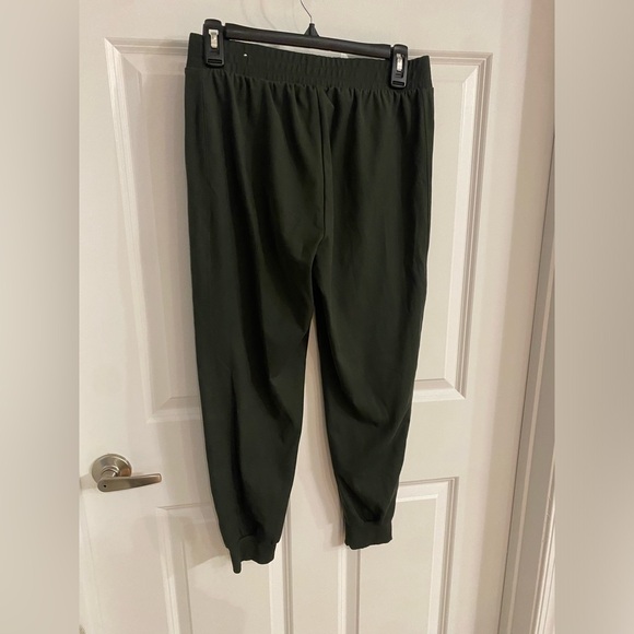 Green joggers with pockets and zipper. Size medium. - Picture 2 of 4